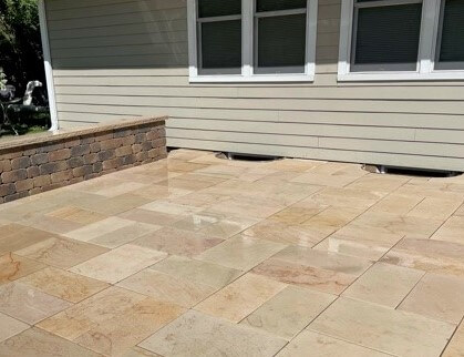 Stone paver patio with small wall 