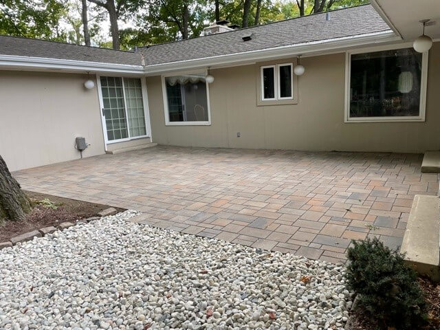 Stone paver patio with gravel walkway