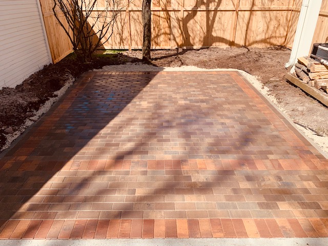 Brick paver patio with multiple colors