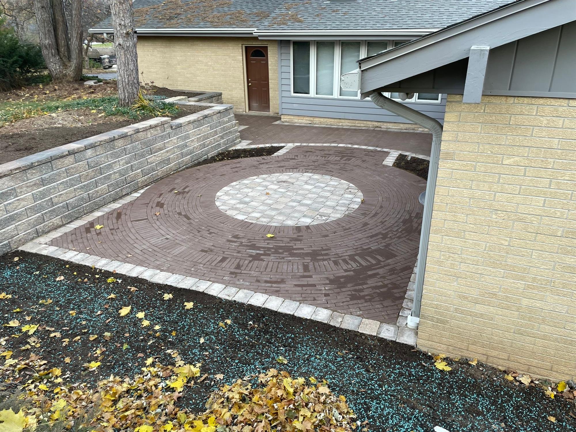 Backyard Patio Enclosed by the House and a Retaining Wall