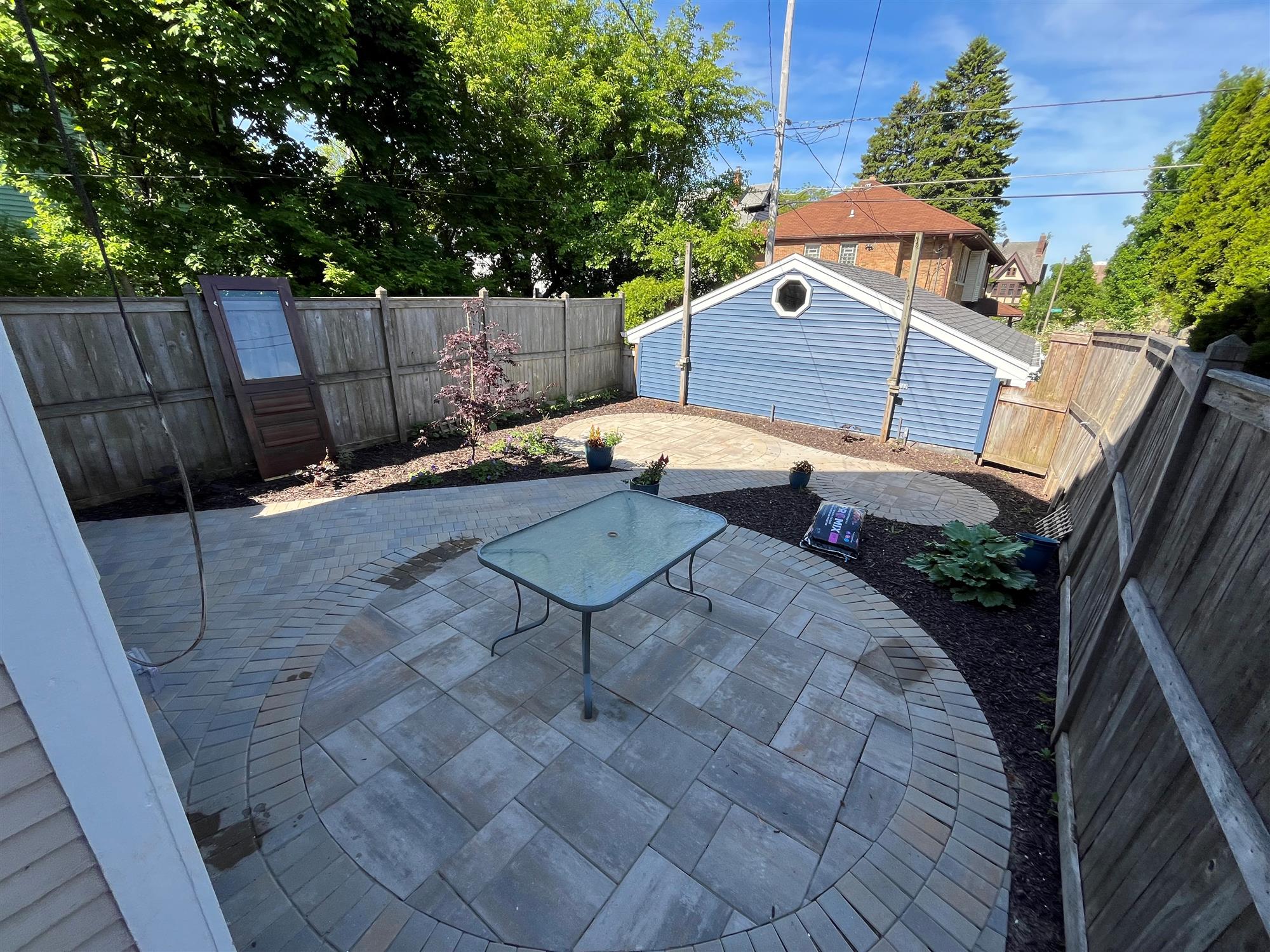 Tranquil Patio with Circular Designs and Mulched Surroundings