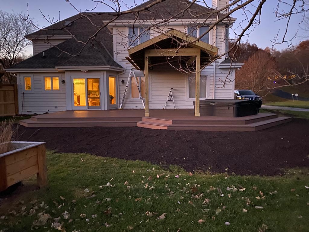 GroundLevel Deck with a Hot Tub Palladium Patios & Landscaping LLC