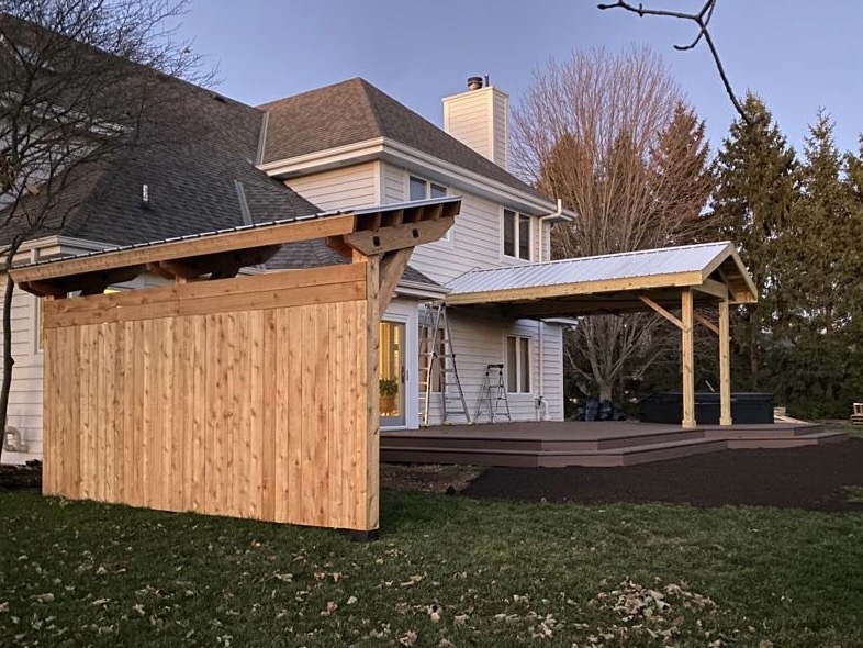 Small Covered Pergola next to a back-porch with an overhang and a Hot Tub