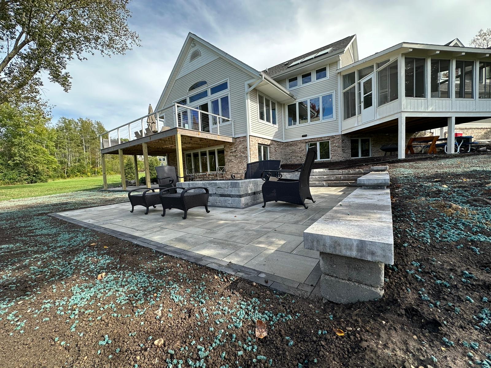 Backyard Patio with a Fire Pit and Small Retaining Walls