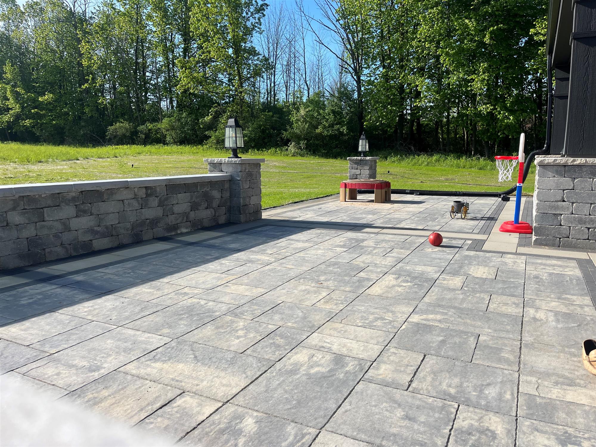 Stone Patio with Built-In Seating Wall