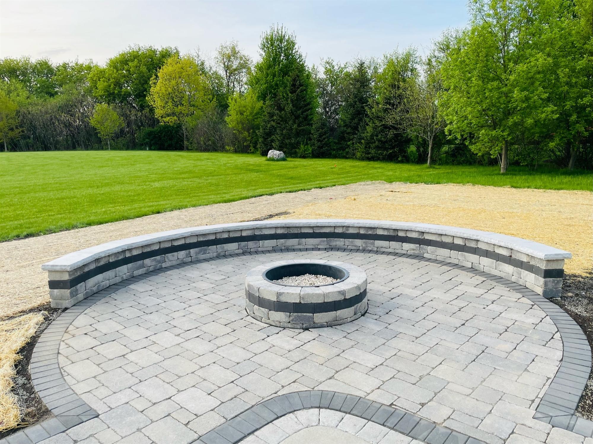 Backyard brick fire pit with sitting wall & patio