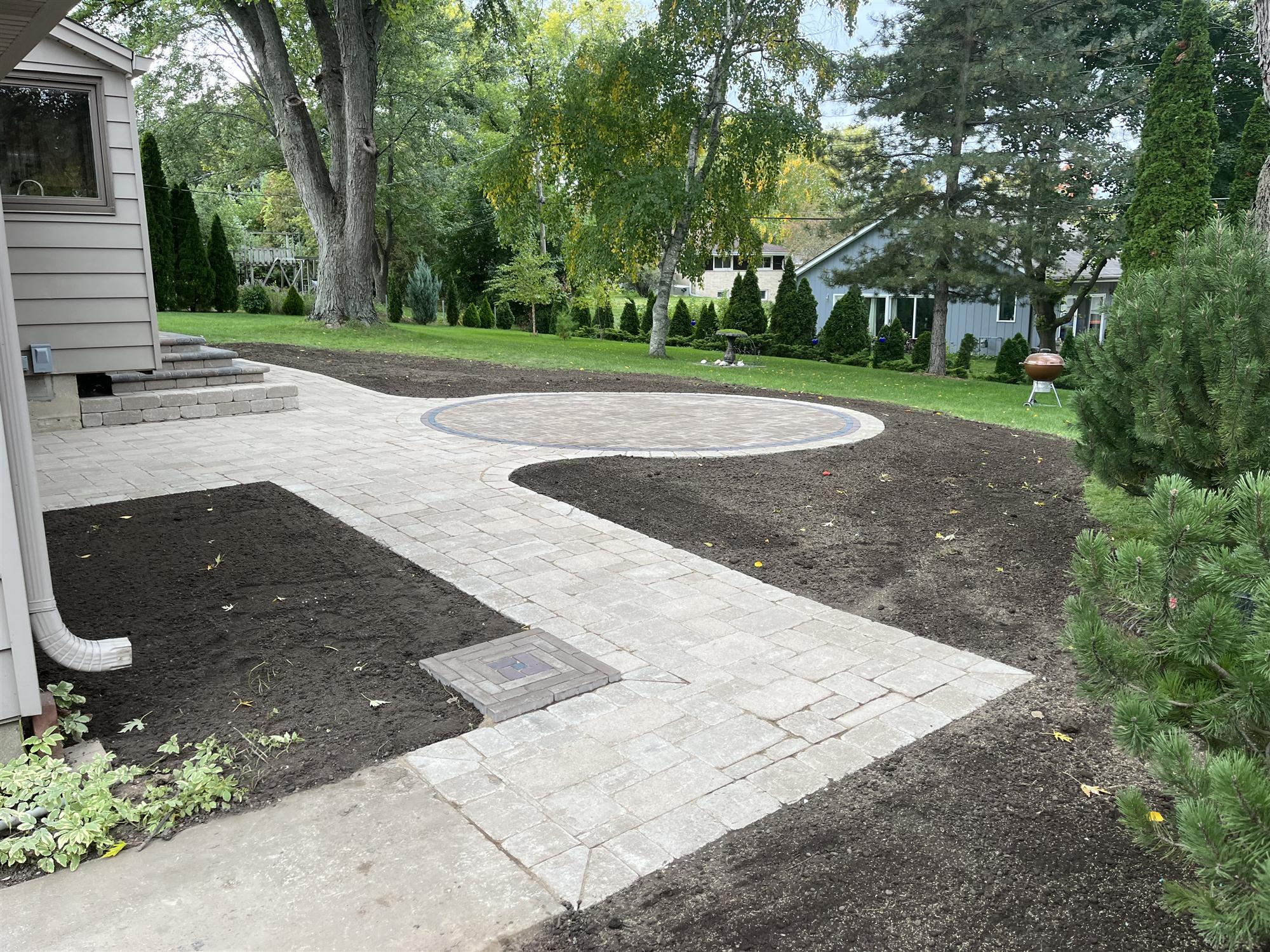 Circular brick patio with walkway