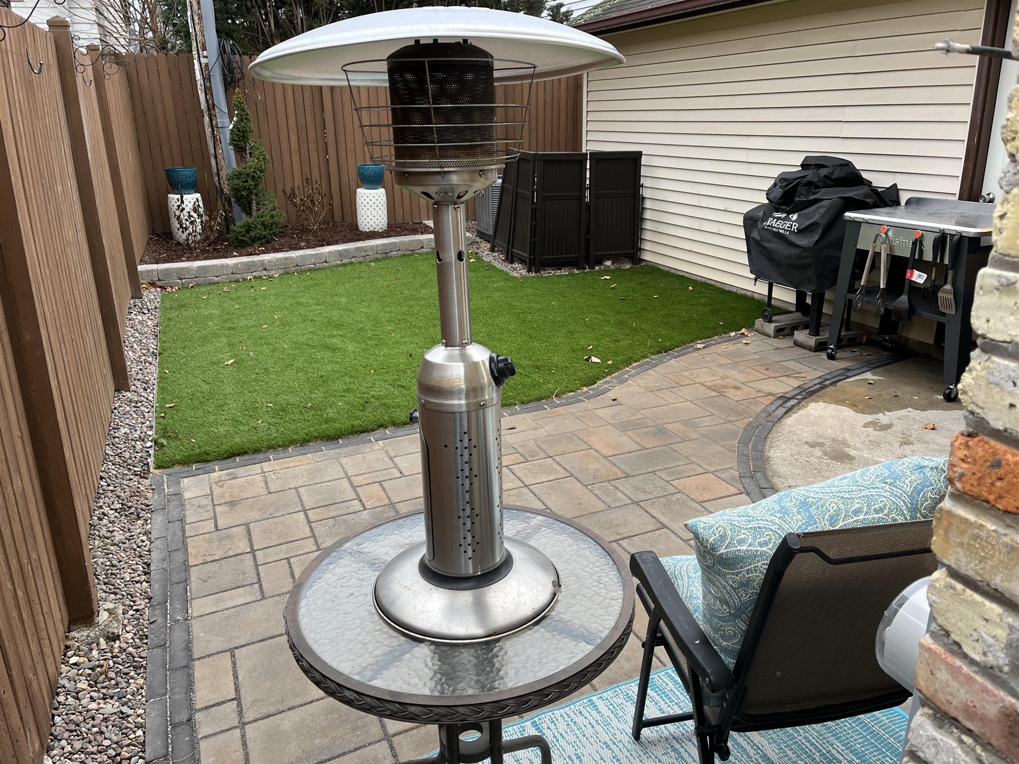 Decorative patio addition with small turf lawn