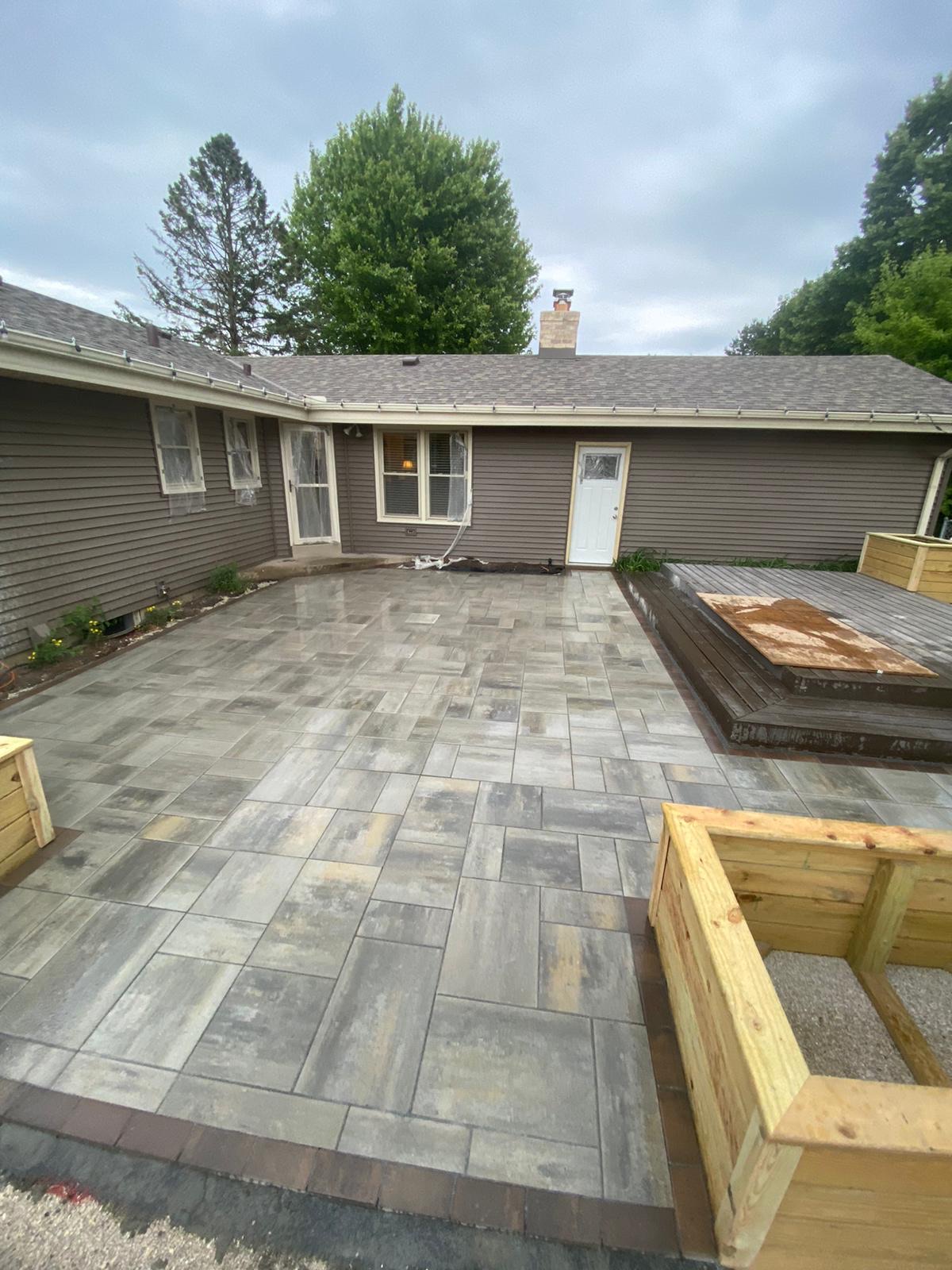 Paved Natural Stone Multi-Level Patio with Large Wooden Planters