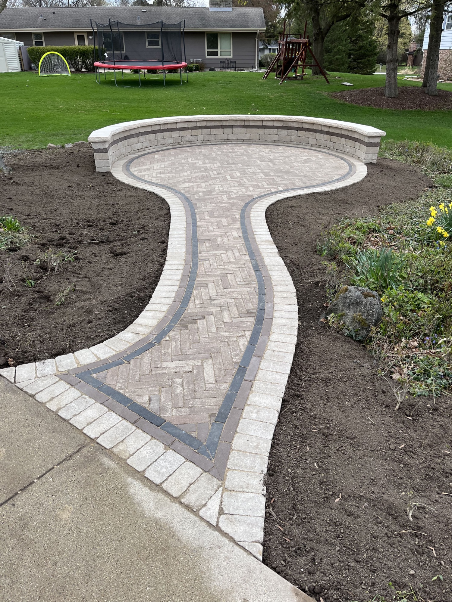 Brick patio extension with pathway & sitting wall