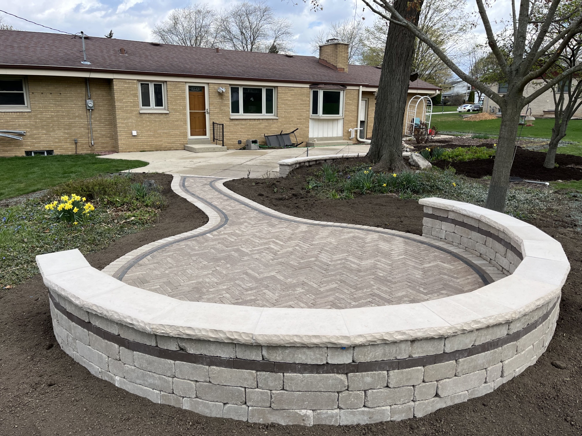 Decorative patio extension with seating area & sitting wall