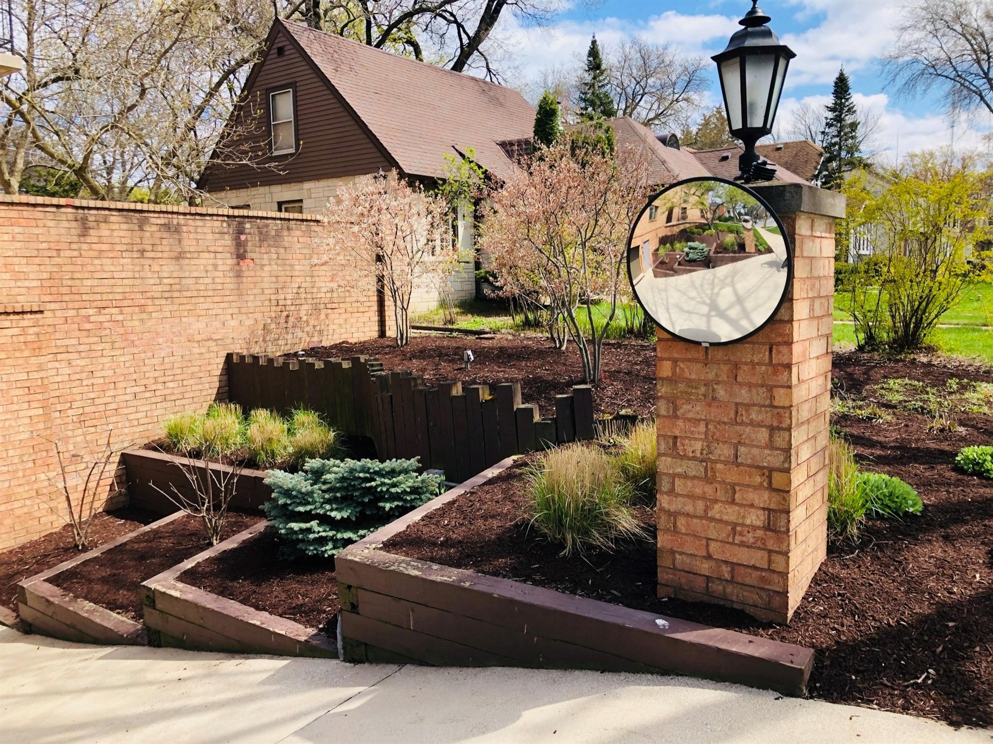 Outdoor landscape with railroad tie retaining walls