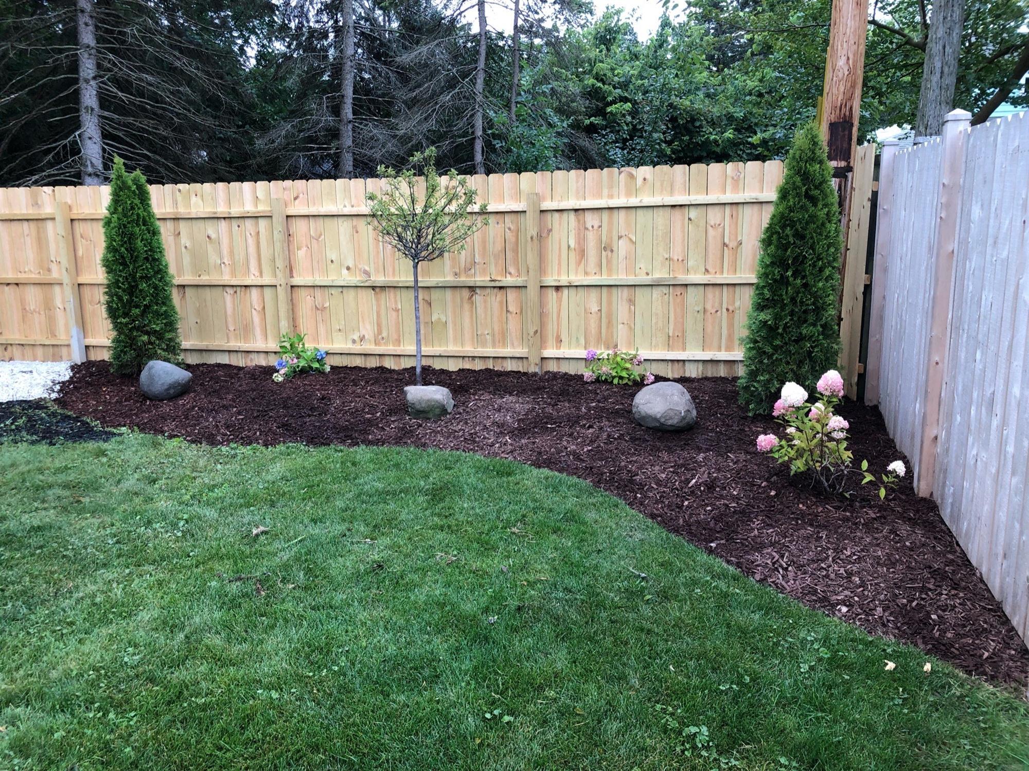 Corner Yard Landscape with Fence