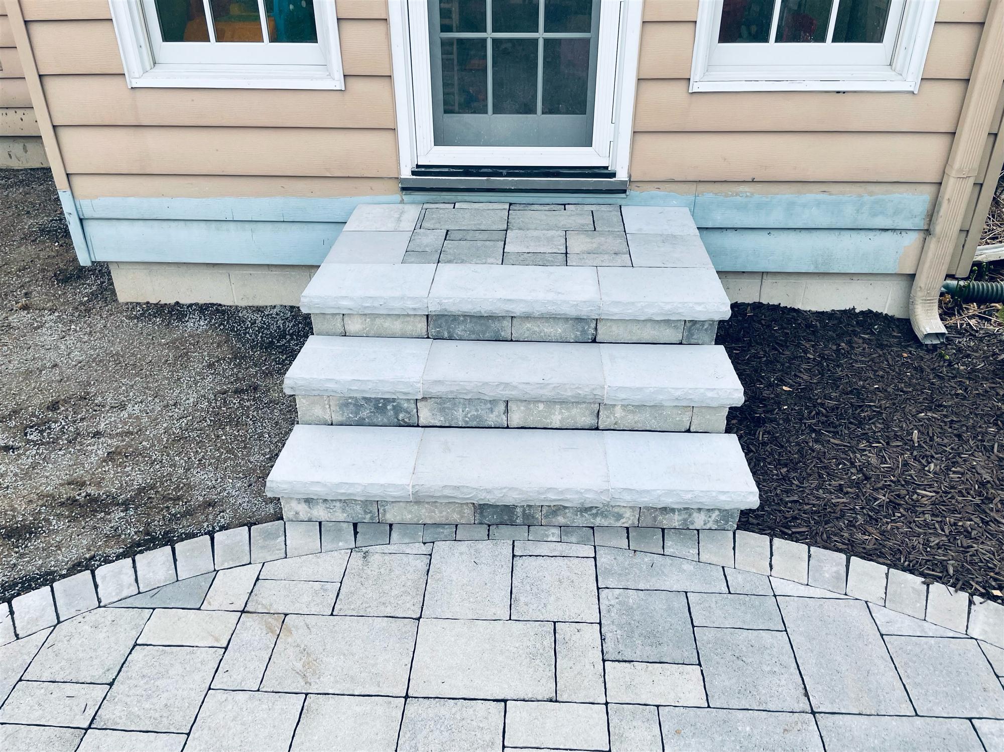 Backyard Stone Patio with Steps