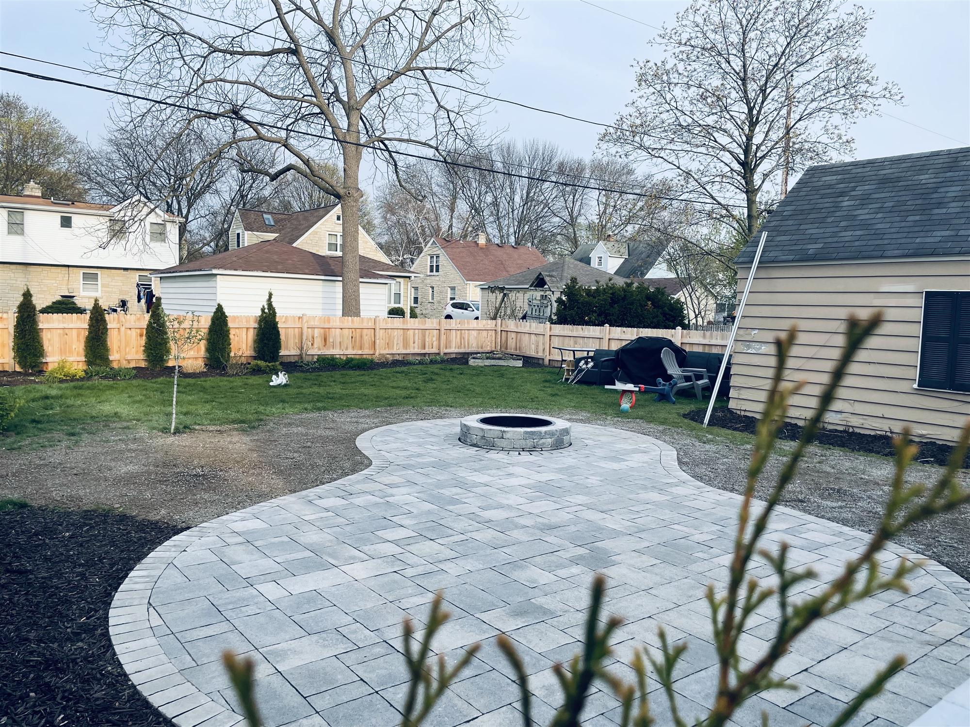 Stone patio with built-in fireplace