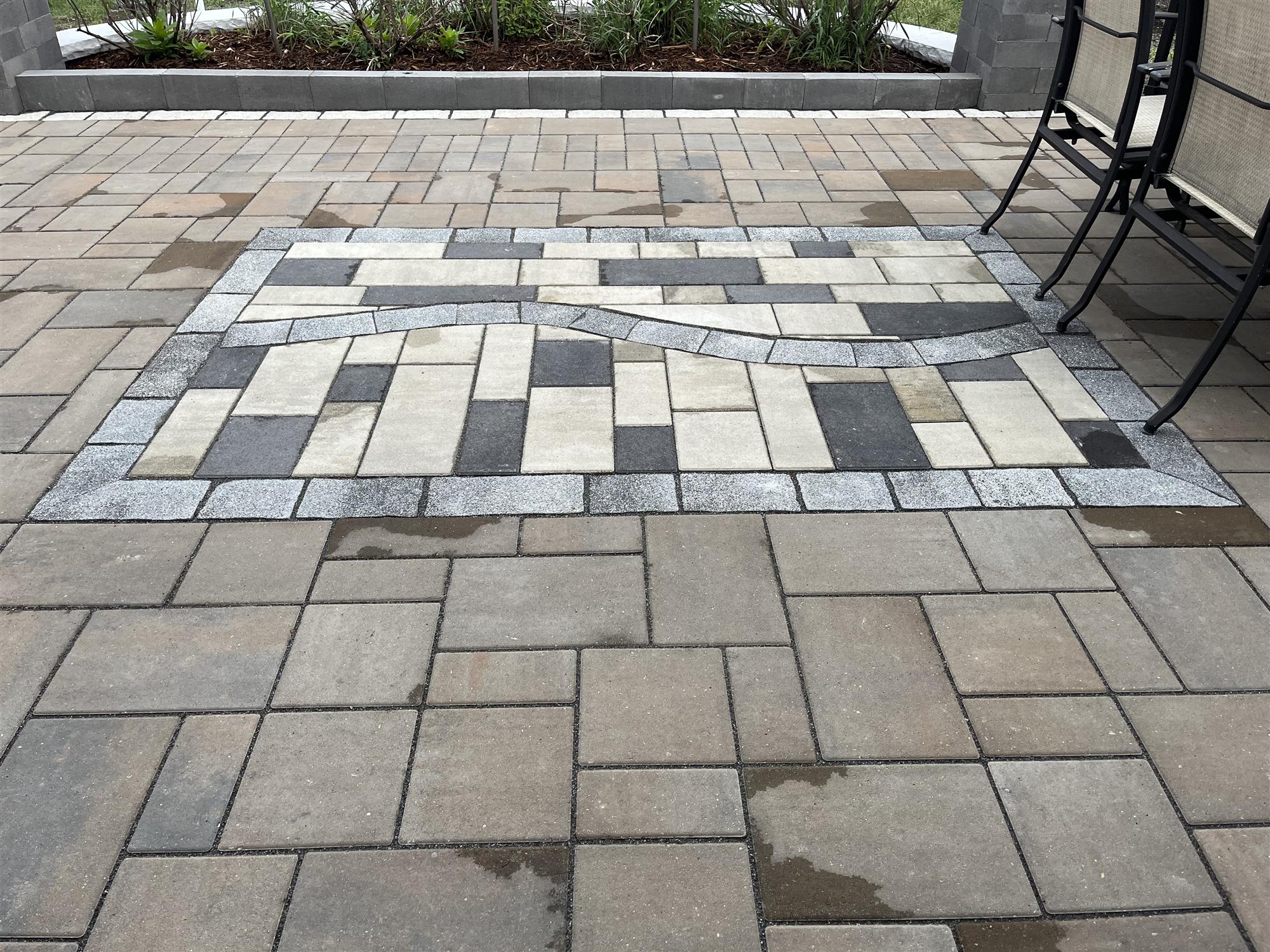 Brick patio with decorative design 