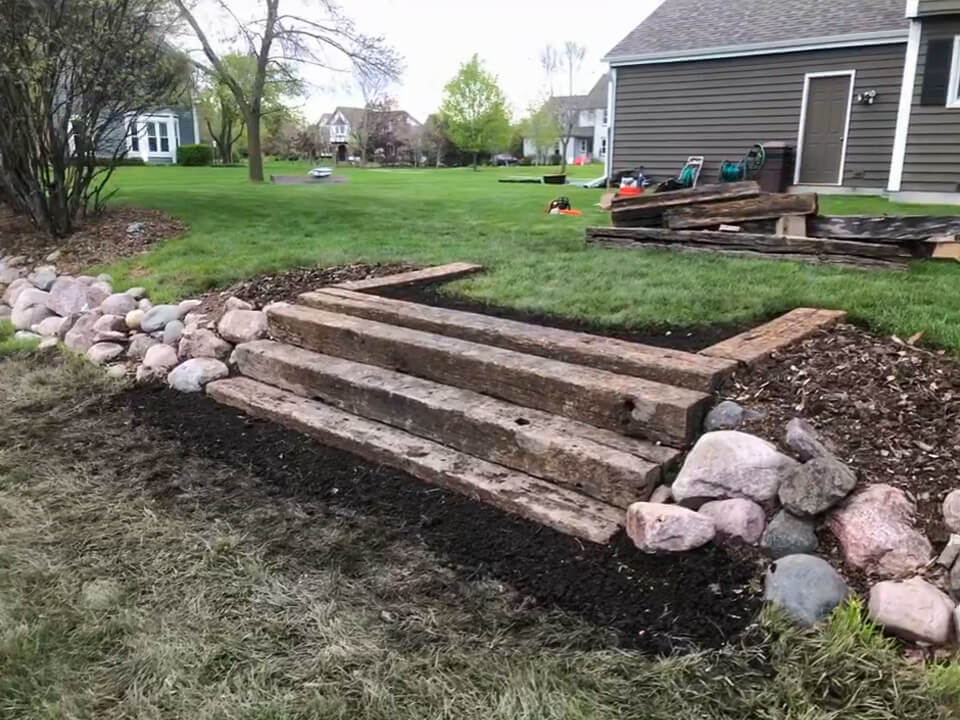 Stone retaining wall with stairs