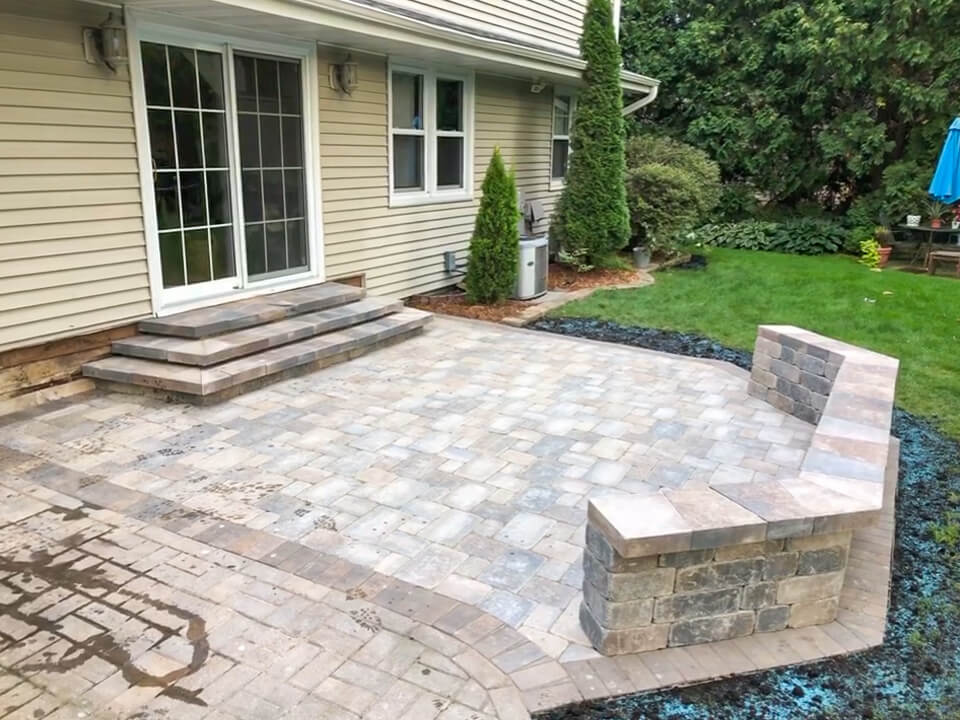Paver stone patio with stairs & sitting wall