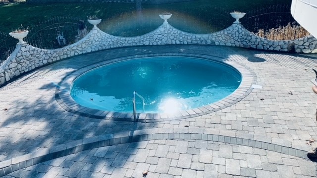 Stone patio around swimming pool